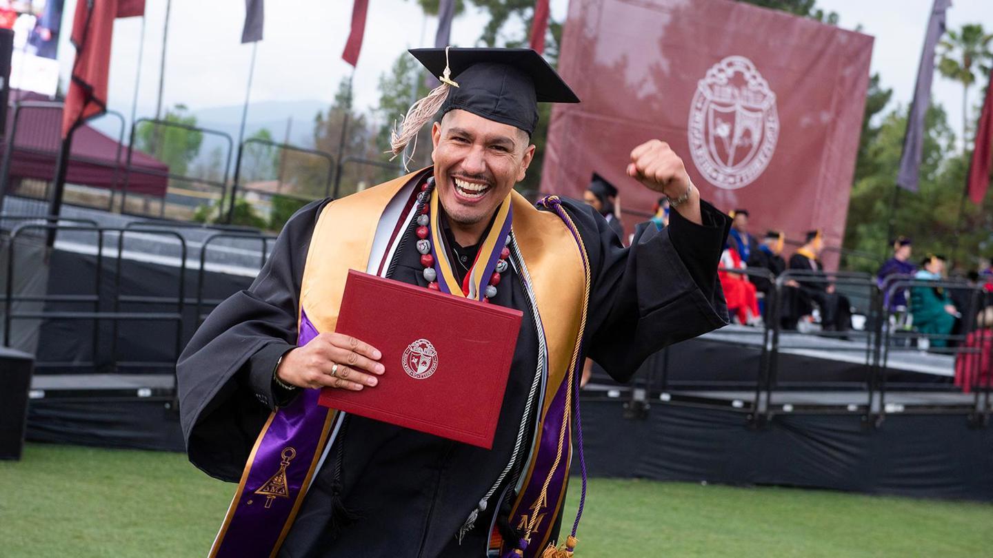 Image card - School of Business graduate student at graduation